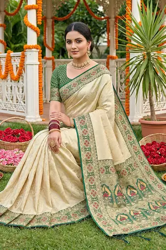 Cream banarasi silk blend saree with dark green zari woven border