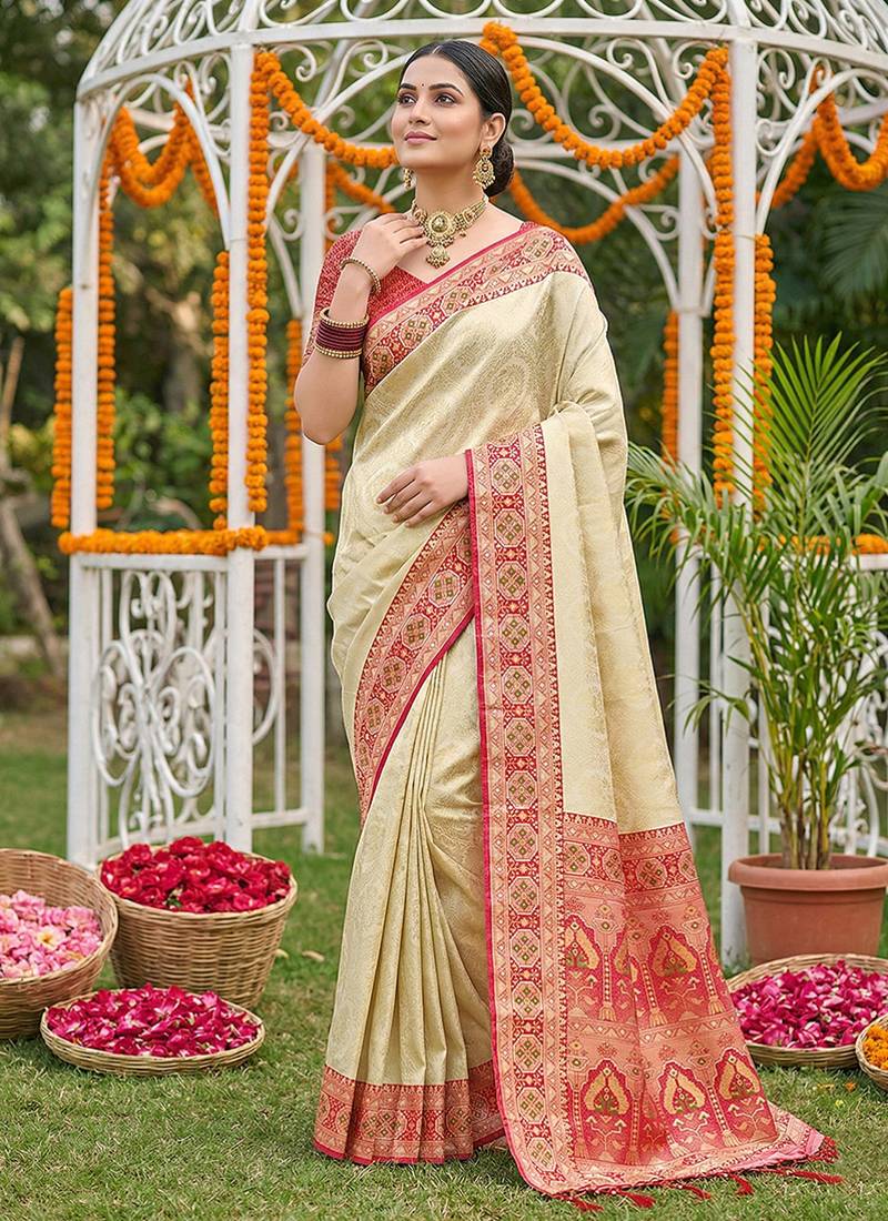 Cream banarasi silk blend saree with red zari woven border