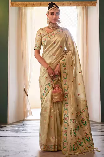 Cream tissue silk blend saree with paithani border and floral pallu