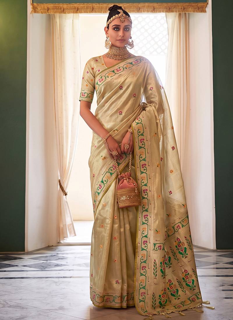 Cream tissue silk blend saree with paithani border and floral pallu