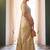 Cream tissue silk blend saree with paithani border and floral pallu