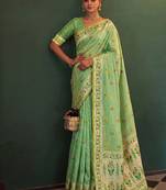 Light green tissue silk blend saree with paithani border and floral pallu