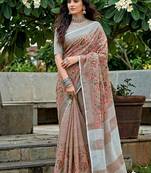 Brown linen cotton blend saree with floral embroidery & tassel pallu