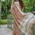 Brown linen cotton blend saree with floral embroidery & tassel pallu