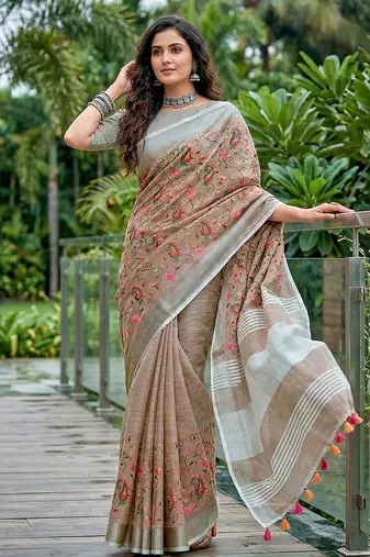 Brown linen cotton blend saree with floral embroidery & tassel pallu