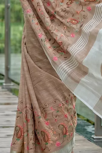 Brown linen cotton blend saree with floral embroidery & tassel pallu