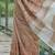 Brown linen cotton blend saree with floral embroidery & tassel pallu