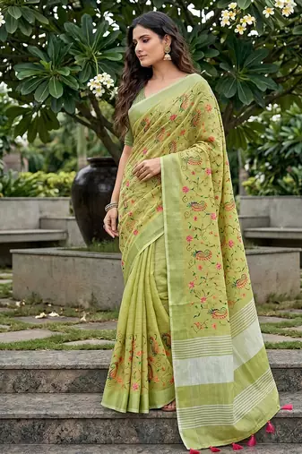 Pista green linen cotton blend saree with floral embroidery & tassel pallu