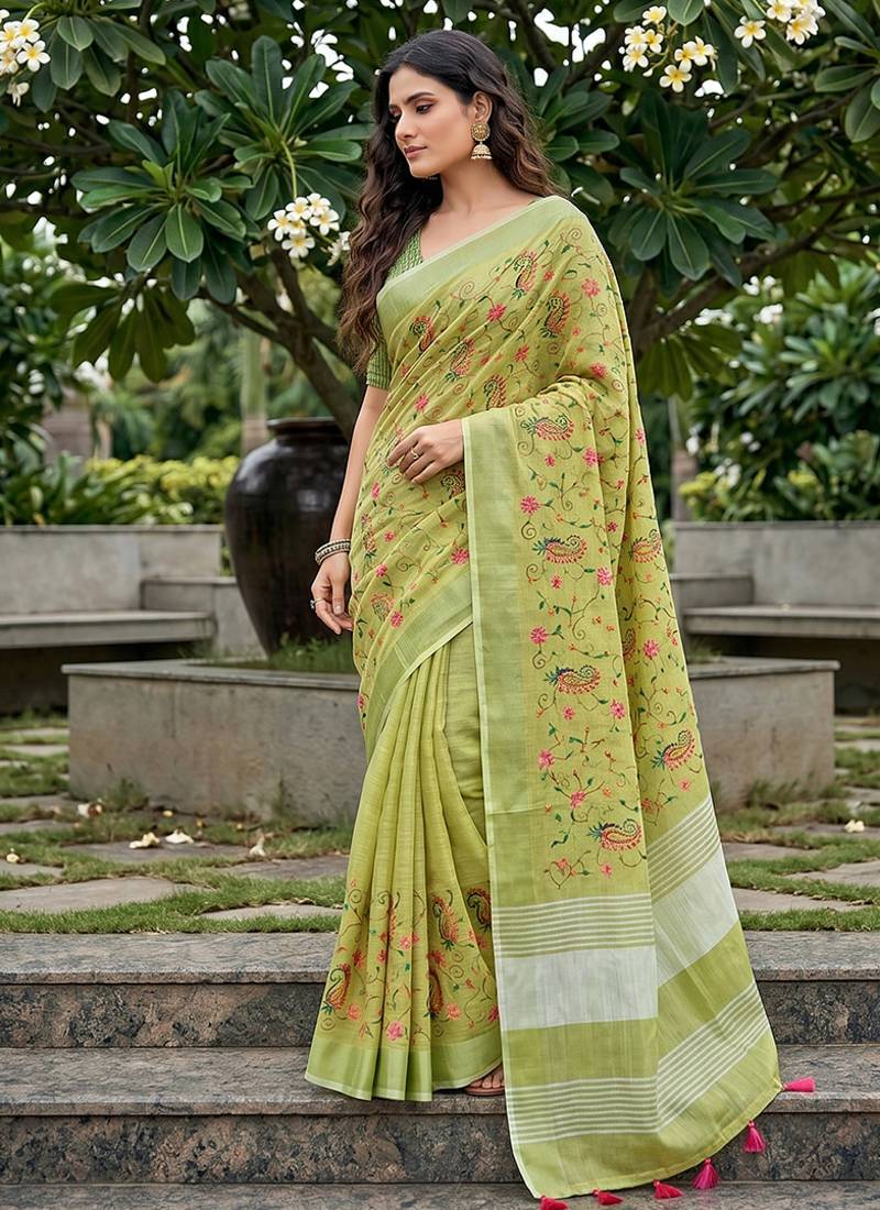 Pista green linen cotton blend saree with floral embroidery & tassel pallu