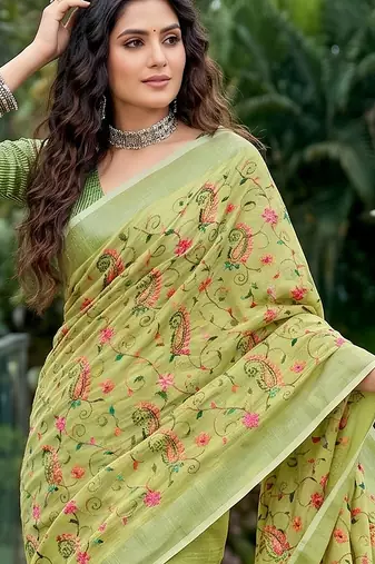 Pista green linen cotton blend saree with floral embroidery & tassel pallu