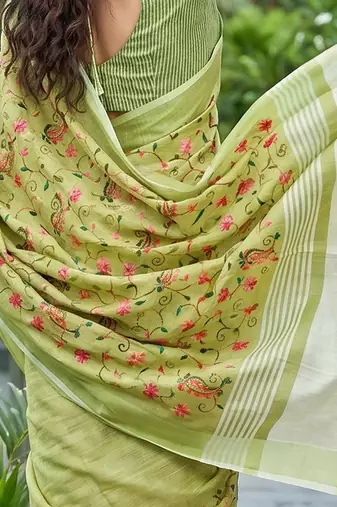 Pista green linen cotton blend saree with floral embroidery & tassel pallu