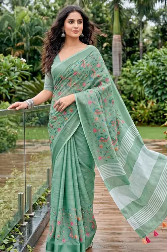 Sea green linen cotton blend saree with floral embroidery & tassel pallu