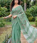 Sea green linen cotton blend saree with floral embroidery & tassel pallu
