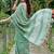 Sea green linen cotton blend saree with floral embroidery & tassel pallu