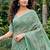 Sea green linen cotton blend saree with floral embroidery & tassel pallu