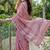 Onion pink linen cotton blend saree with floral embroidery & tassel pallu