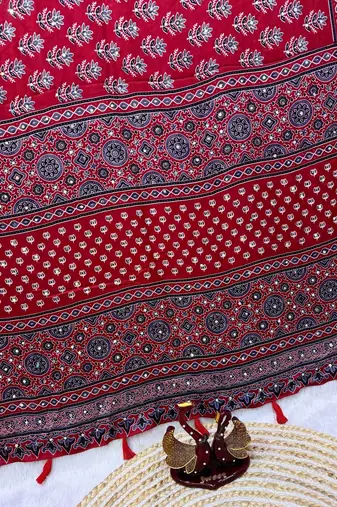 Red Color Ajarakh Print With Mirror Work And Latkan Satin Crepe Saree 
