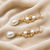 Pearl drop dangle earrings with crystal accents, gold tone
