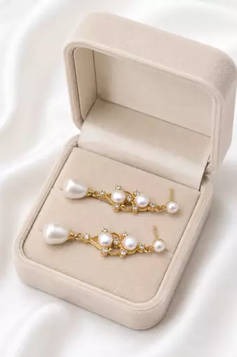 Pearl drop dangle earrings with crystal accents, gold tone