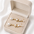 Pearl drop dangle earrings with crystal accents, gold tone