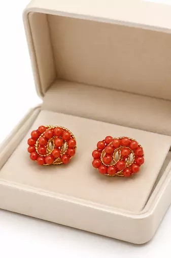 Coral bead stud earrings with gold twisted wire detail