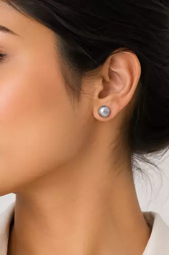 Grey pearl stud earrings with gold-tone backs, round