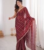 Maroon color silk blend embroidered work saree with un-stitched blouse