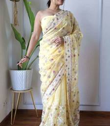 Yellow net embroidered aari work heavy look ethnic saree with blouse