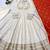 Beige heavy lace work cosmos gold anarkali suit set