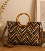  lines & loops tan jacquard chevron handheld bag
