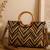  lines & loops tan jacquard chevron handheld bag