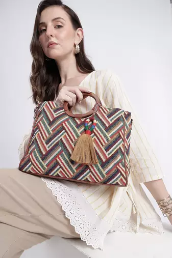  lines & loops tan jacquard chevron handheld bag