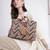  lines & loops tan jacquard chevron handheld bag