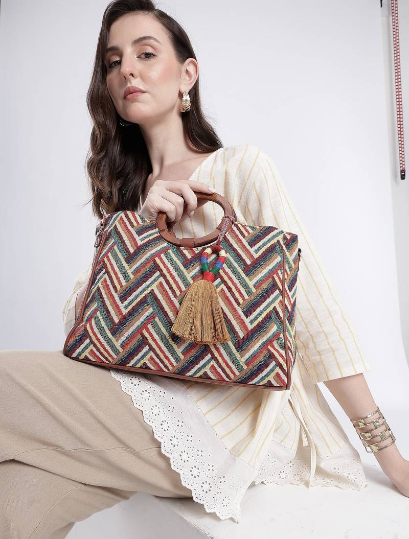  lines & loops tan jacquard chevron handheld bag