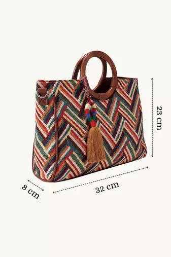  lines & loops tan jacquard chevron handheld bag