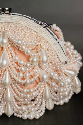 Pink pearl beaded suede clutch