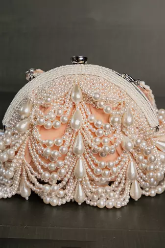 Pink pearl beaded suede clutch