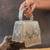 Ivory silver beaded silk handbag