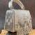 Ivory silver beaded silk handbag