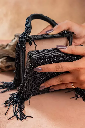 Jet black weave fringe silk handbag