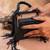 Jet black weave fringe silk handbag
