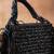 Jet black weave fringe silk handbag