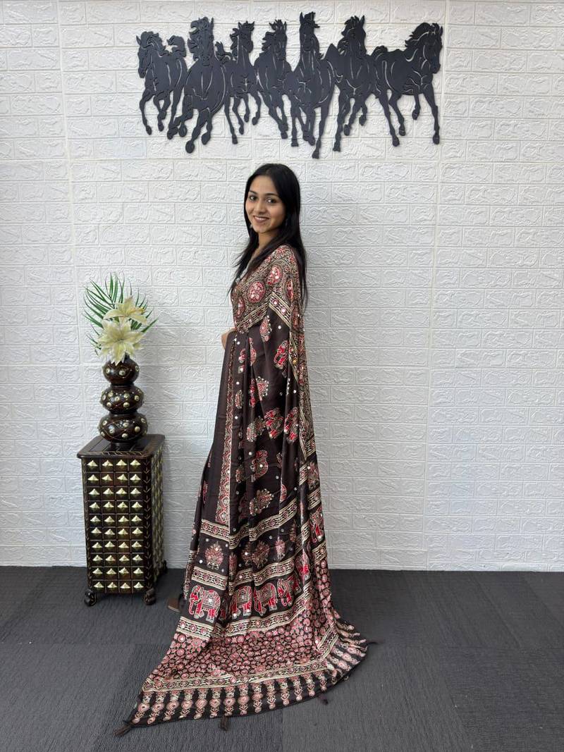 dark brown color mirror work border with handcrafted red tassels (latkan) and ajarakh print gajji silk blend saree