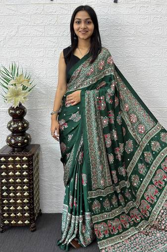 green color mirror work border with handcrafted red tassels (latkan) and ajarakh print gajji silk blend saree