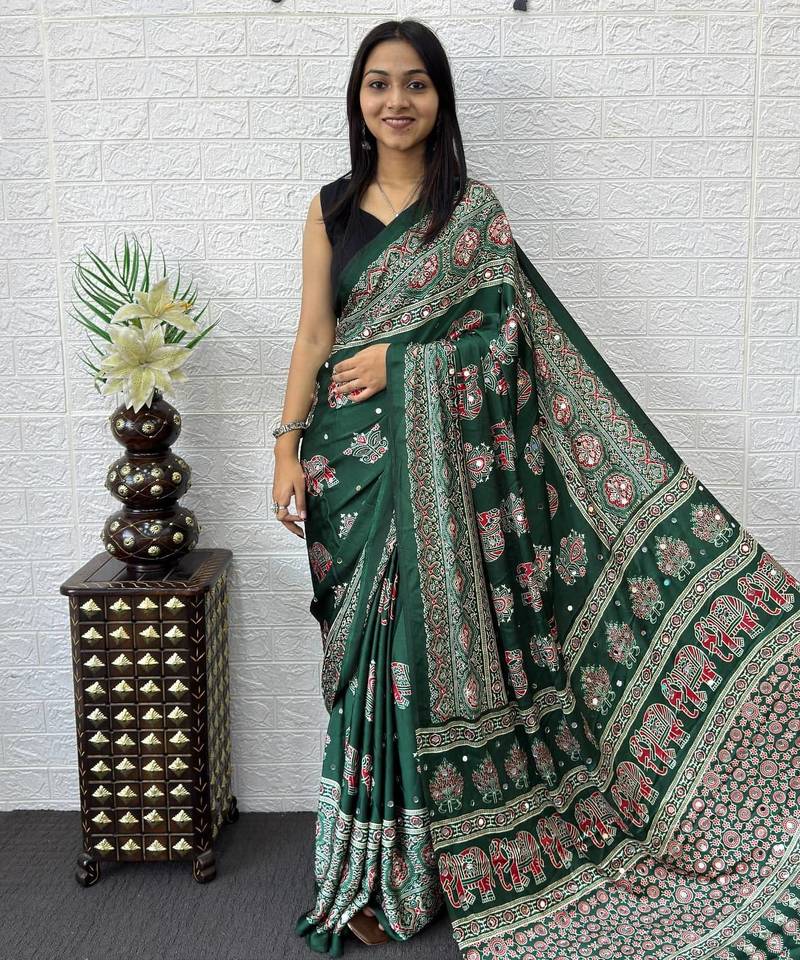 green color mirror work border with handcrafted red tassels (latkan) and ajarakh print gajji silk blend saree
