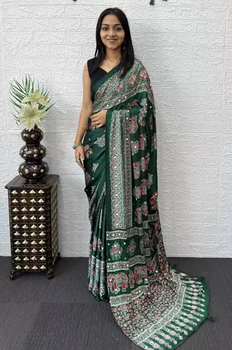 green color mirror work border with handcrafted red tassels (latkan) and ajarakh print gajji silk blend saree
