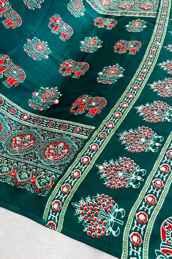 green color mirror work border with handcrafted red tassels (latkan) and ajarakh print gajji silk blend saree