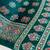 green color mirror work border with handcrafted red tassels (latkan) and ajarakh print gajji silk blend saree
