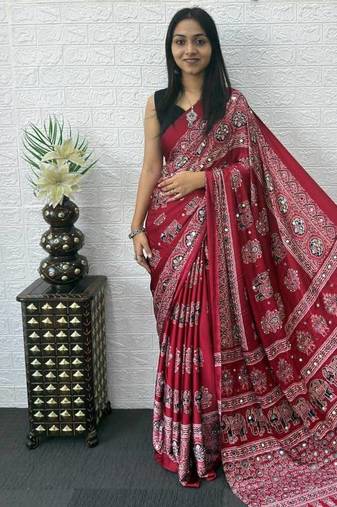 maroon color mirror work border with handcrafted red tassels (latkan) and ajarakh print gajji silk blend saree