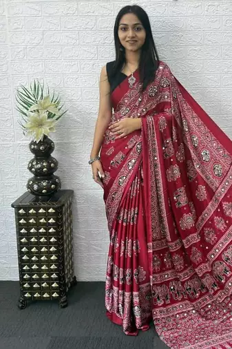 maroon color mirror work border with handcrafted red tassels (latkan) and ajarakh print gajji silk blend saree